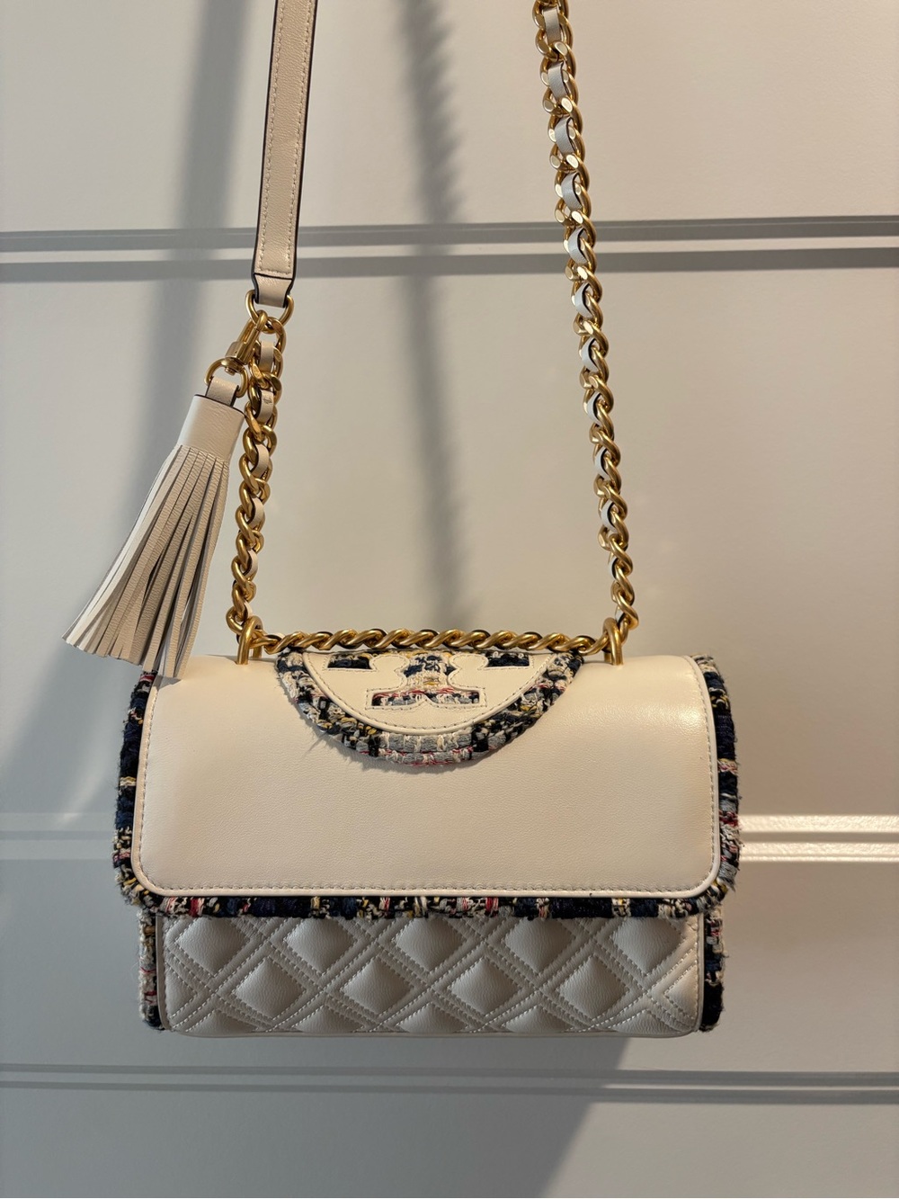 Tory Birch gold chain, White Quilted leather Bag with Tassel and magnet close